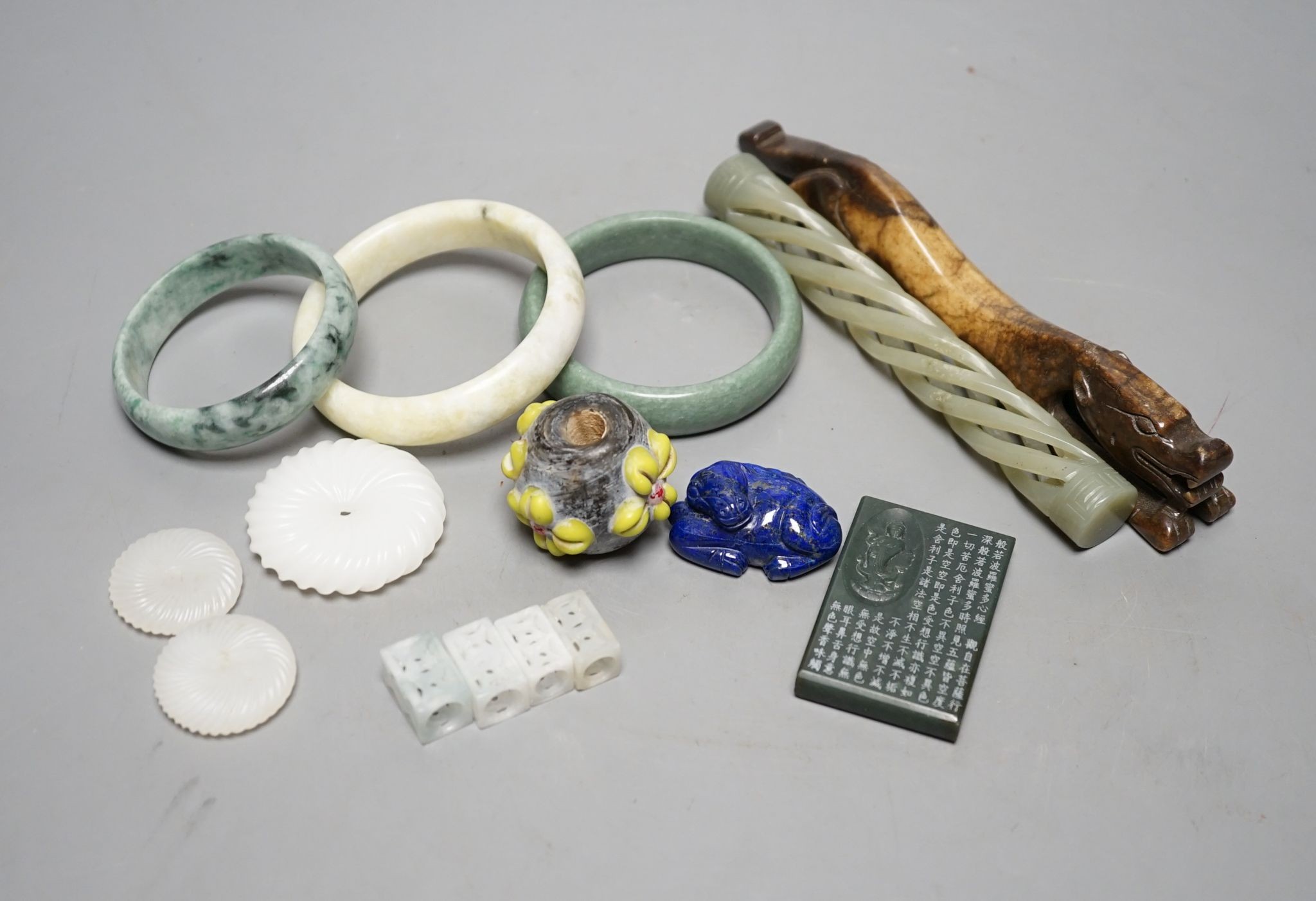 A group of Chinese carvings, including three bangles